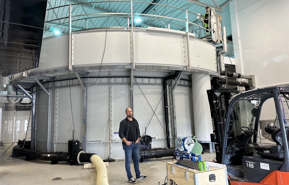 OFS technical manager Yngve Hjertenes in front of the tank used to grow fish to 2kg to prove its suitably to regulators. The development of the system has a long history, including iterations used in Ireland and Scotland.
