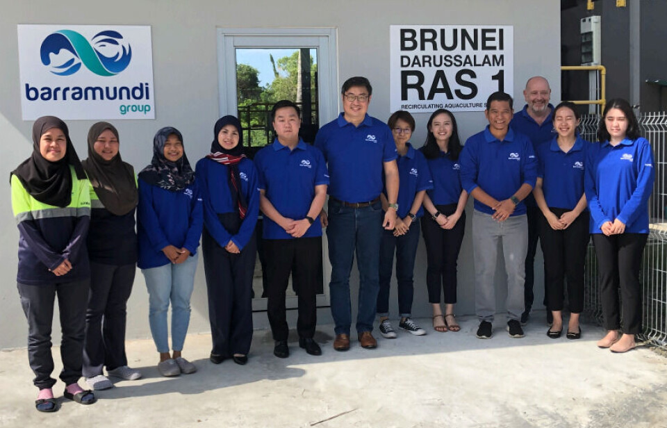 Barramundi Group chief executive James Kwan, sixth from left, with staff in Brunei.