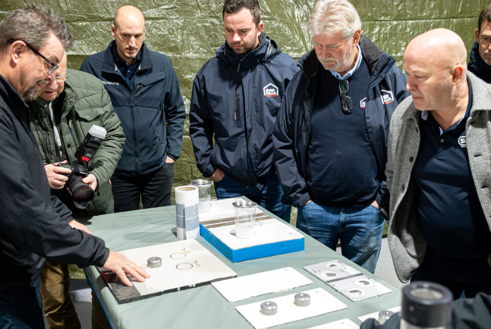 Silikal's Frode Reppe, left, explains the coatings to both the press and people from both the producer and supplier sectors.
